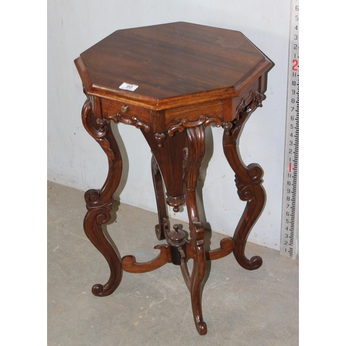 99 - A 19th century mahogany trumpet sewing table on impressive wooden carved base