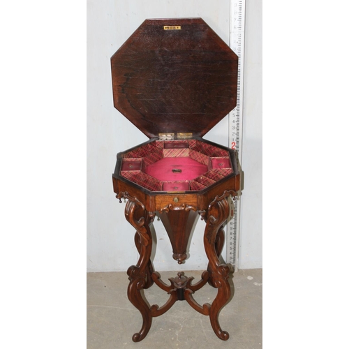 99 - A 19th century mahogany trumpet sewing table on impressive wooden carved base