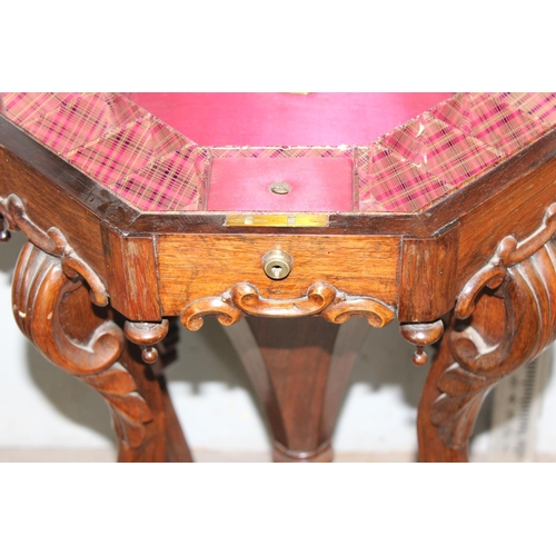 99 - A 19th century mahogany trumpet sewing table on impressive wooden carved base