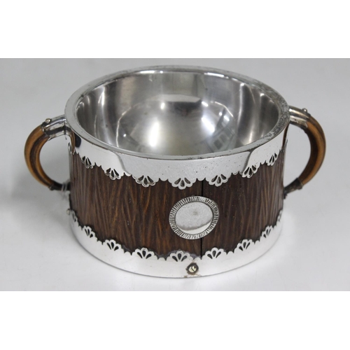 1103 - An unusual Hukin & Heath silver plate mounted wine taster cup with carved wooden body formed as ivor... 