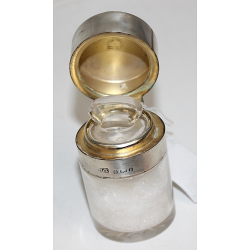 1107 - 2 silver topped dressing table jars