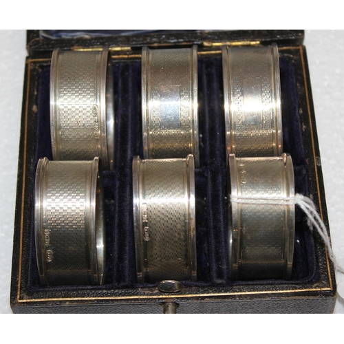 1122 - Set of 6 boxed silver napkin rings, Birmingham 1975 by Broadway & Co, approx 74g gross