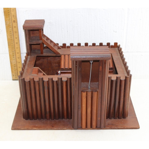 1519 - Vintage wooden fort with a quantity of Britains cowboys and Indians, dated 1971 on metal bases