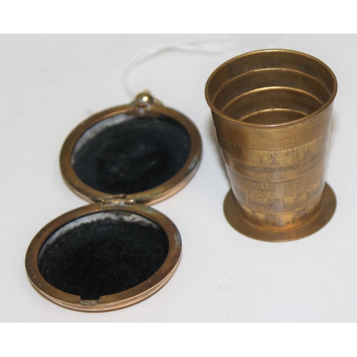 1619 - An unusual brass cased patent folding shot cup, number 15061, Newcastle Royal Exhibition engraving