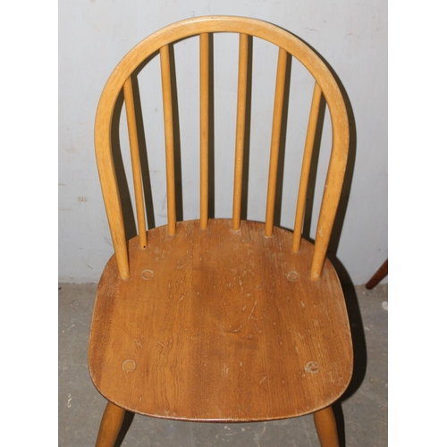 165 - A matched set of 4 blonde Ercol hoop back dining chairs