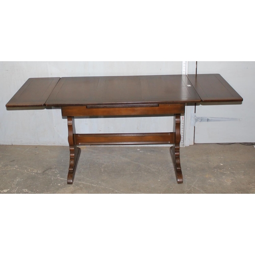 166 - A vintage Ercol extending dining table