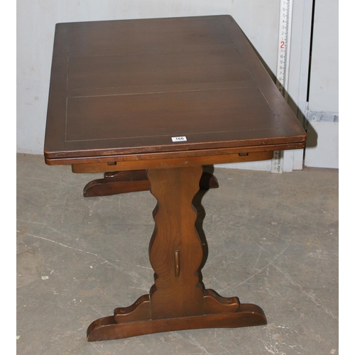 166 - A vintage Ercol extending dining table