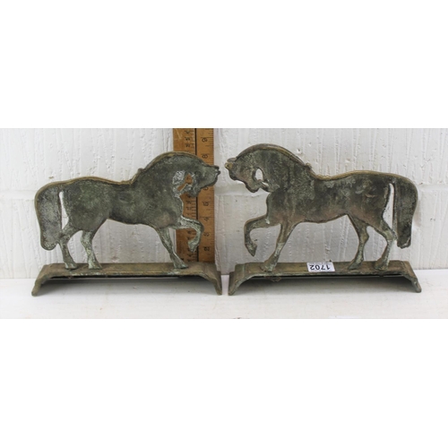 1702 - A pair of vintage brass door stops formed as horses