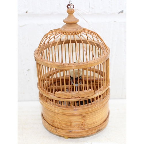 1624 - A vintage wooden cased clockwork automaton bird in cage