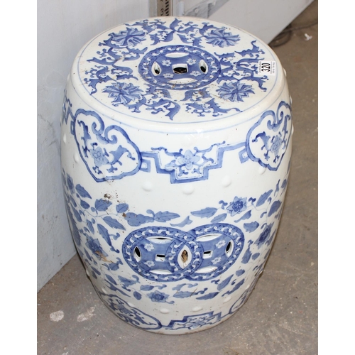 320 - A large 20th century Chinese blue & white pottery garden seat decorated with dragons