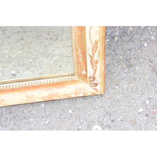 411 - 19th century gilt framed overmantel mirror with floral decoration