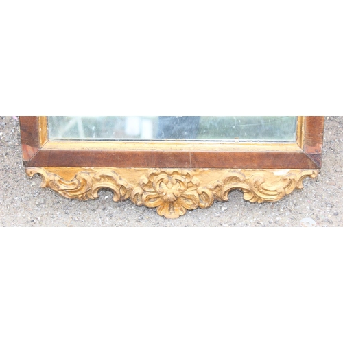 412 - Antique wooden framed mirror with impressive gilt decoration