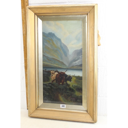 440 - 19th century oil on canvas of Highland cattle near mountains and a loch, in gilt frame, signed indis... 