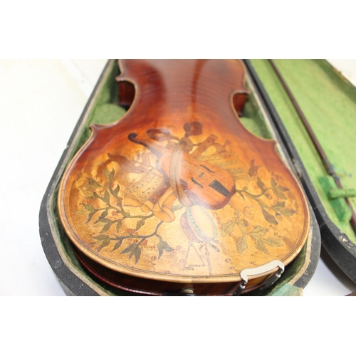 654 - After Gaspard Duiffo - An excellent quality violin with carved male head and marquetry inlaid back, ... 