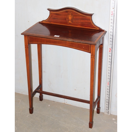 144 - An Edwardian mahogany side table with shaped back and Sheraton type inlay