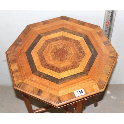 145 - An impressive octagonal lamp table with specimen wooden top