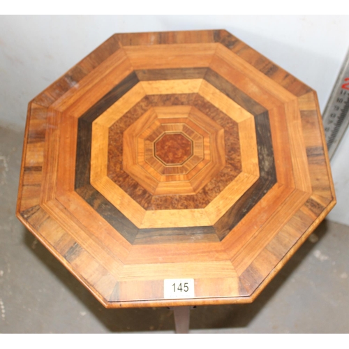 145 - An impressive octagonal lamp table with specimen wooden top