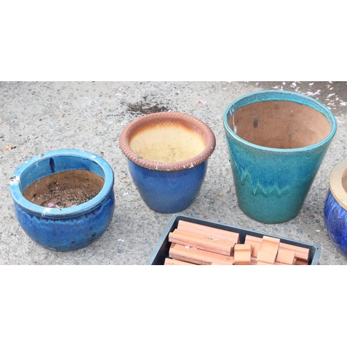 353 - Qty of assorted glazed garden pots and feet etc