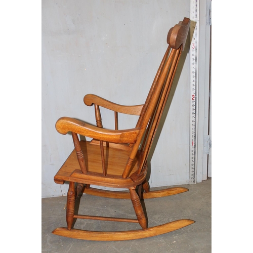 177 - A vintage wooden rocking chair