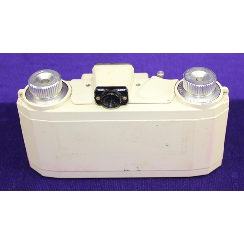 703 - A rare Ilford Advocate Camera, cream enamel finish and leather case, with Dallmeyer Anasigmat 35mm f... 