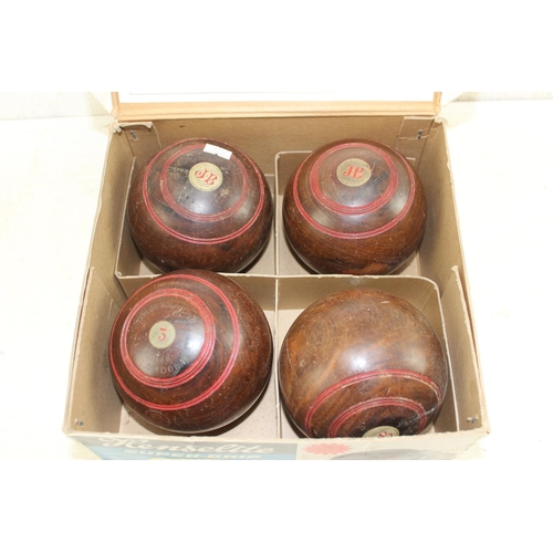 766 - A set of 4 vintage wooden bowls balls in later box