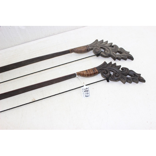 1019 - 2 Asian carved wooden archery bows