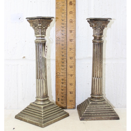 1168 - A pair of silver plated candlesticks formed as Corinthian columns