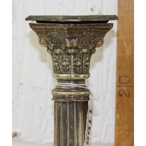 1168 - A pair of silver plated candlesticks formed as Corinthian columns