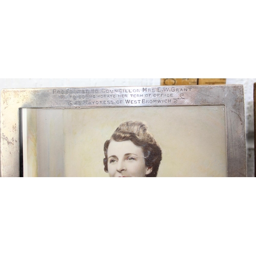 1169 - A pair of silver photograph frames, both Birmingham 1945 by Sanders & Mackenzie, each bearing inscri... 