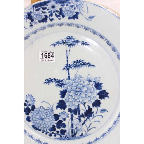 1684 - A large 18th/ 19th century Chinese porcelain charger with blue and white decoration of flowers, appr... 