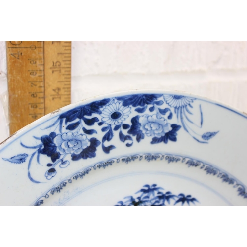 1684 - A large 18th/ 19th century Chinese porcelain charger with blue and white decoration of flowers, appr... 