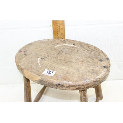 183 - A vintage rustic elm stool