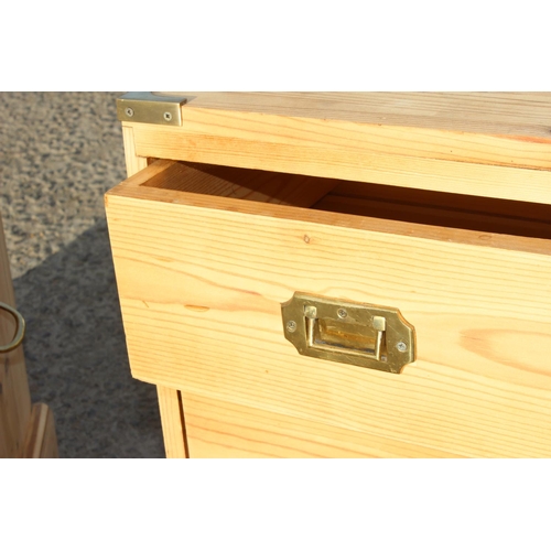 184 - A pair of modern pine bedside cabinets with campaign style brass handles and corners