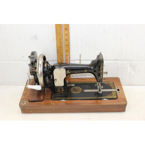 910 - Antique Vesta sewing machine in wooden case