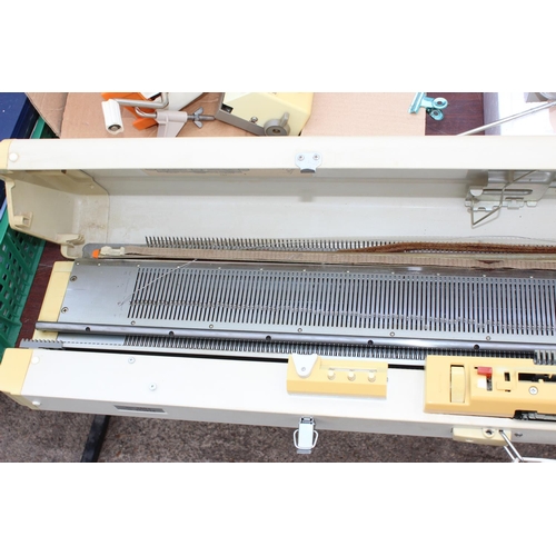 915 - Empire Knitmaster knitting machine and a huge qty of extra parts, ephemera etc