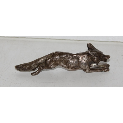 1173 - A heavy cast silver model of a running fox, London 1977, makers mark obscured, approx 86.9g gross