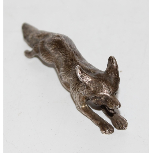 1173 - A heavy cast silver model of a running fox, London 1977, makers mark obscured, approx 86.9g gross