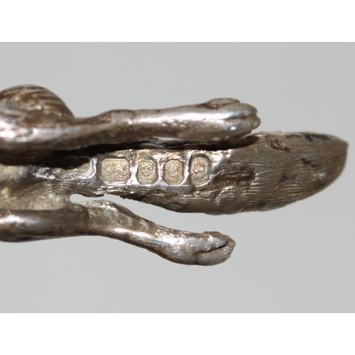 1173 - A heavy cast silver model of a running fox, London 1977, makers mark obscured, approx 86.9g gross