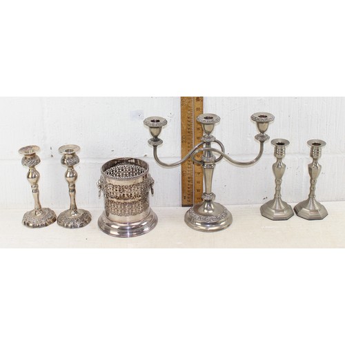 1152 - A large box of assorted silver plated items, mainly candlesticks, some pairs