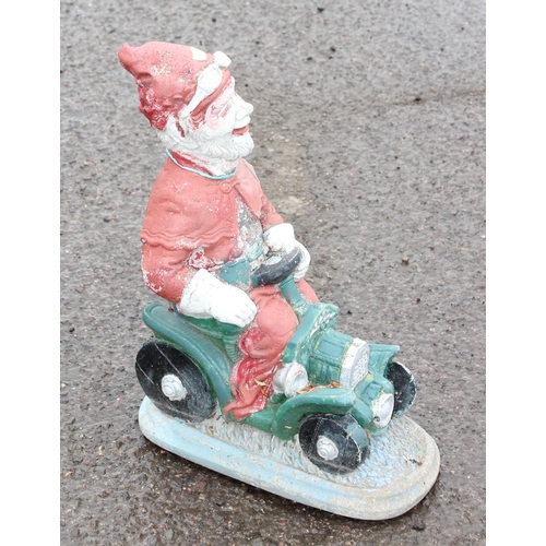 391 - Garden ornament of a gnome driving a car