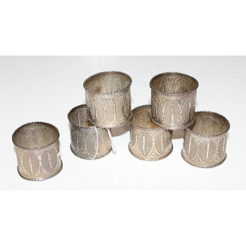 1142 - 6 white metal napkin rings, marked indistinctly, possibly Arabic