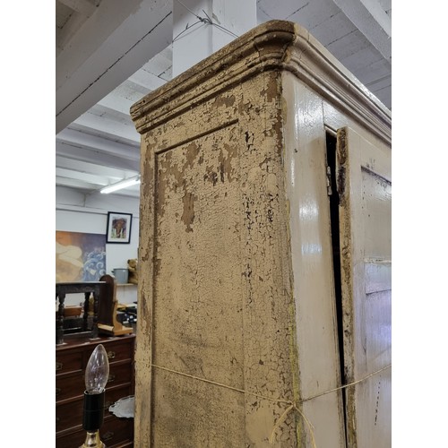 19 - A large Victorian white painted pine cupboard with 2 central drawers, approx 86