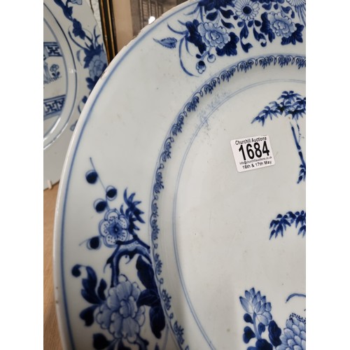 1684 - A large 18th/ 19th century Chinese porcelain charger with blue and white decoration of flowers, appr... 