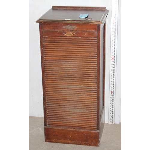 1 - An early 20th century oak tambour fronted cabinet, with key