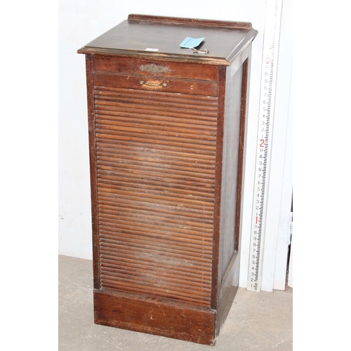 1 - An early 20th century oak tambour fronted cabinet, with key