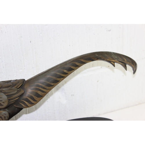 1702 - In the manner of Rene Papa, a large Art Deco style patinated bronze model of a pheasant on 2 step ba... 