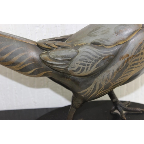 1702 - In the manner of Rene Papa, a large Art Deco style patinated bronze model of a pheasant on 2 step ba... 