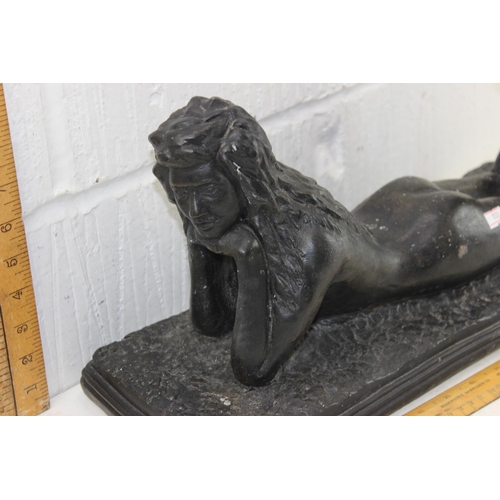 1703 - A large bronzed patinated figure of a recumbent nude female, unsigned