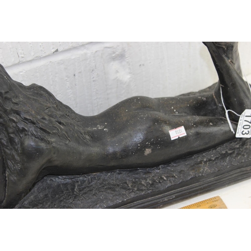 1703 - A large bronzed patinated figure of a recumbent nude female, unsigned