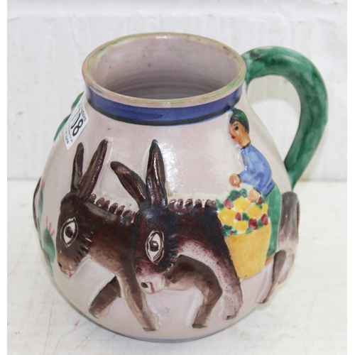 1708 - A vintage Italian pottery jug decorated in relief with Donkeys